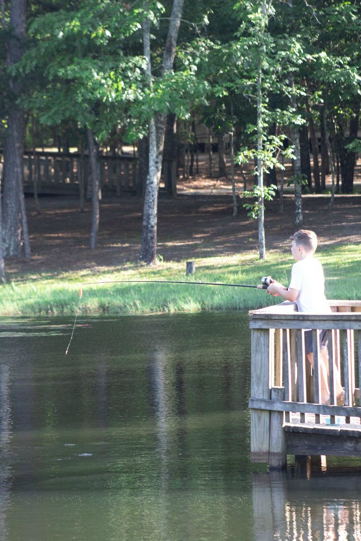 Family Fun at Little Black Creek Campground and Park fishing pier near cabins