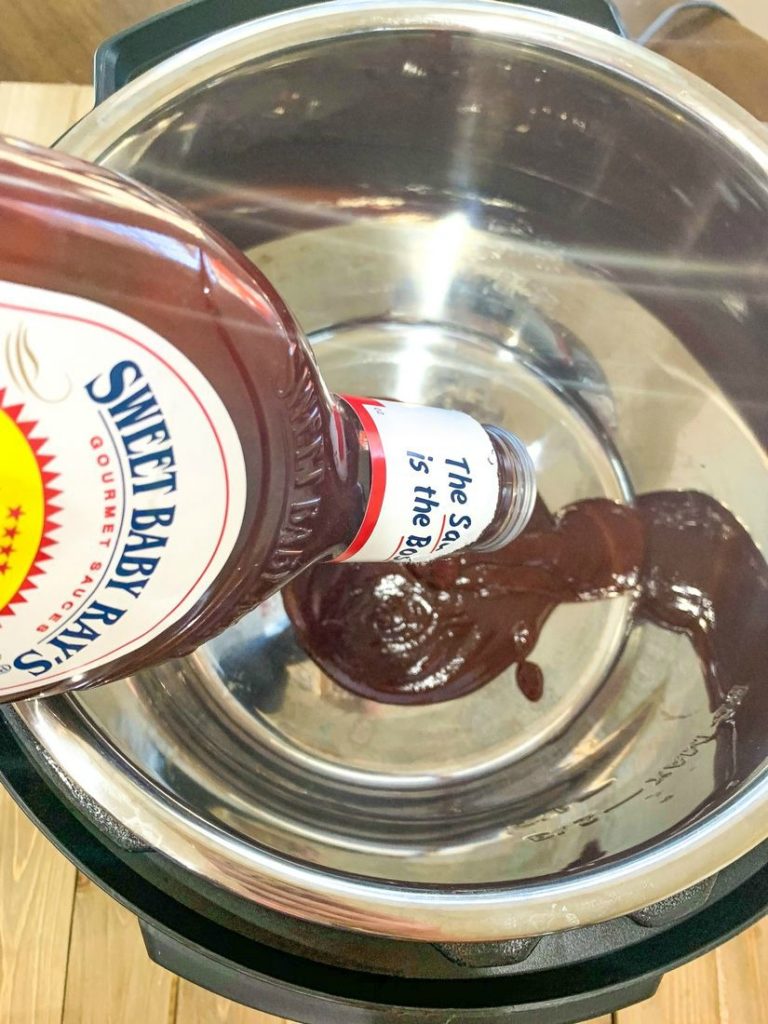 Instant Pot Little Smokies Pouring Barbecue Sauce