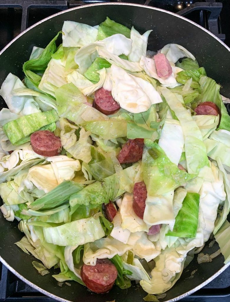 Southern Fried Cabbage With Sausage frying up the cabbage and sausage