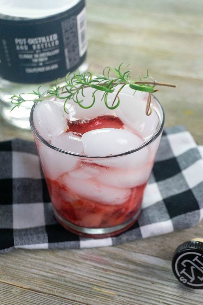 Glass filled with Strawberry Rosemary Moonshine