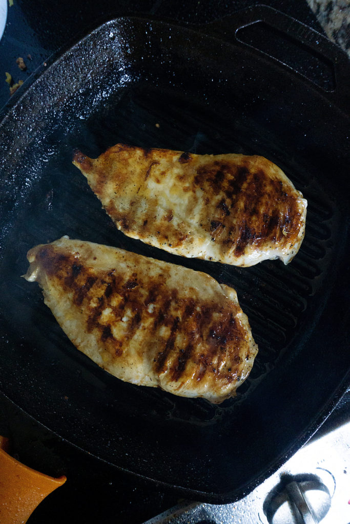 Chicken Breast cooking in skillet on stove
