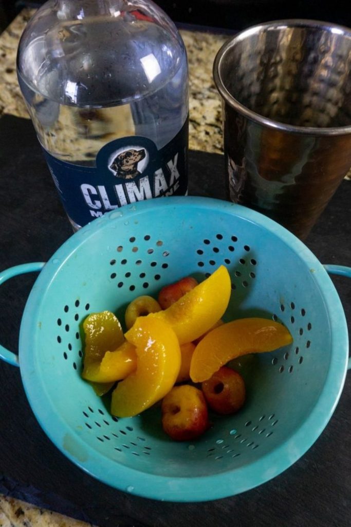 Peach and Rainier Cherries in a colander 