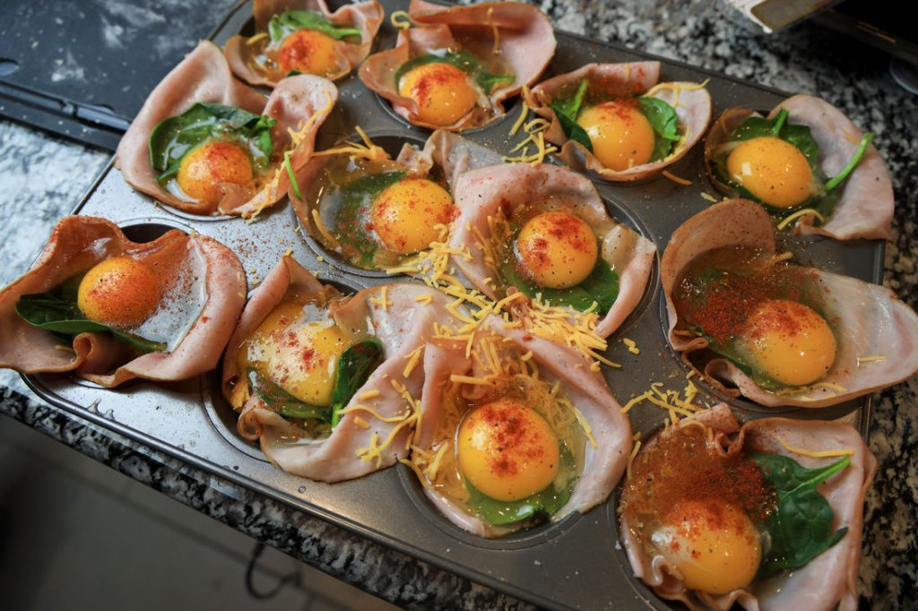 Cheesy Ham Baked Egg Cups Process Image in Tin Muffin with Eggs