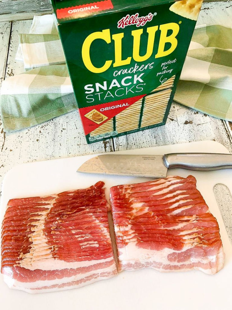 Bacon Cut in half on cutting board process photo
